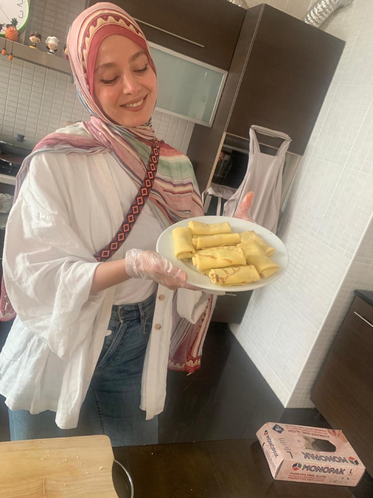 Guest holding homemade Azerbaijani dolma in a Baku cooking class